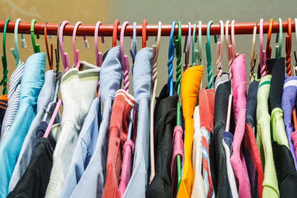 clothing rack with hanging clothes