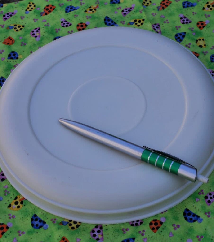 lid sitting on a piece of material