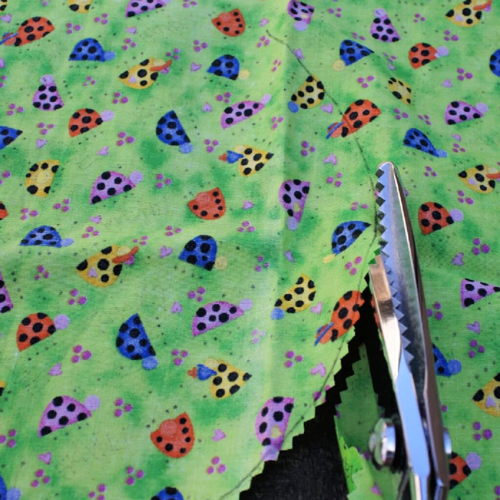 scissors cutting a piece of fabric
