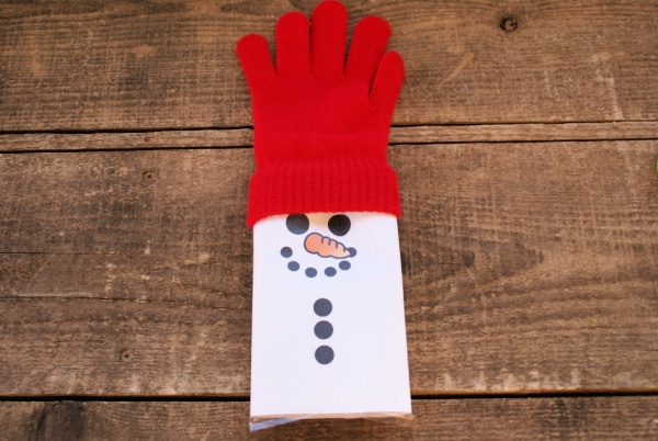 adding red gloves to a popcorn snowman wrapper craft