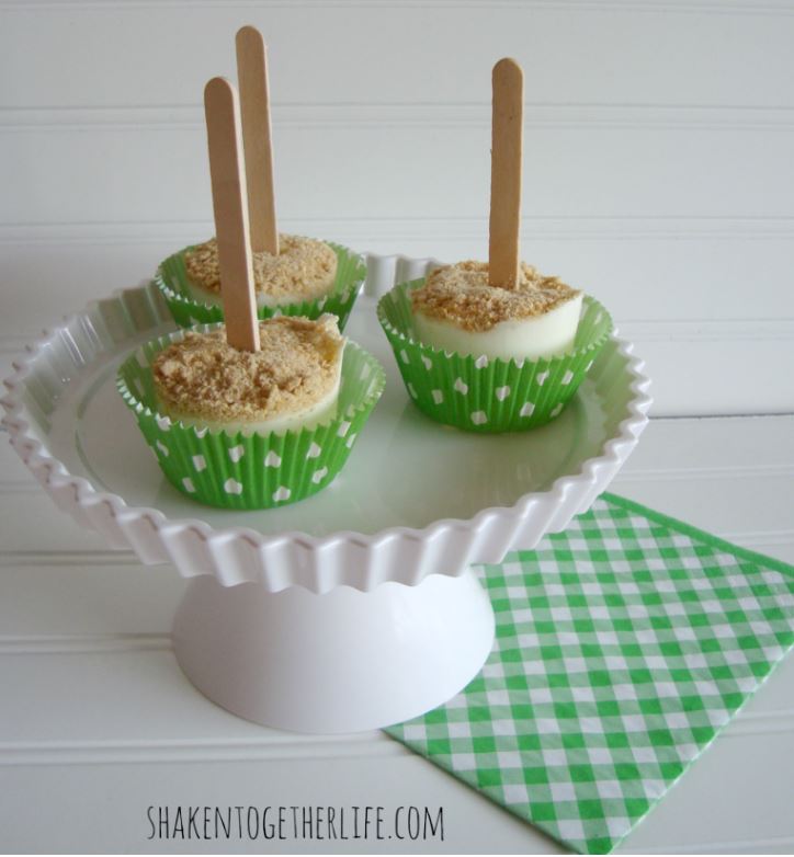 3 lime pops on a cake stand