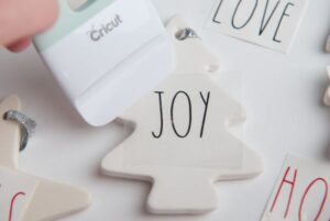steps for making Easy DIY Rae Dunn Ornaments with Cricut