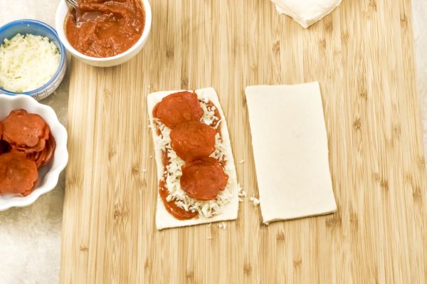 assembling homemade pizza pockets
