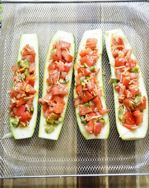air fryer zucchini boats on a tray ready to be air fried