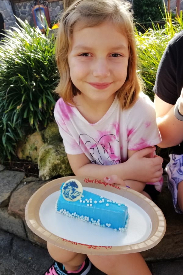 young girl with a dessert at Epcot Norway pavilion