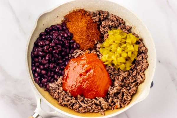 combining ingredients to make healthy beef enchiladas