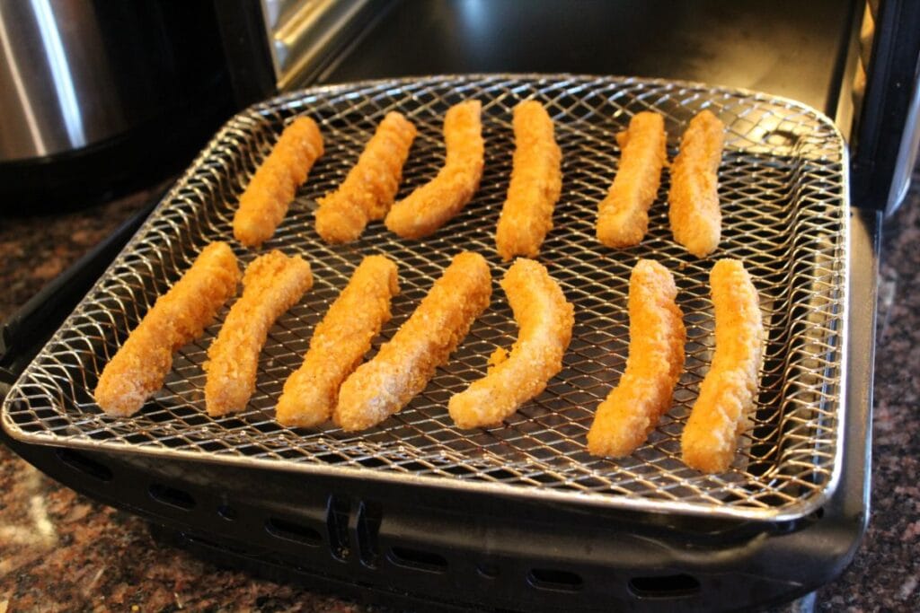frozen chicken fries in an air fryer oven