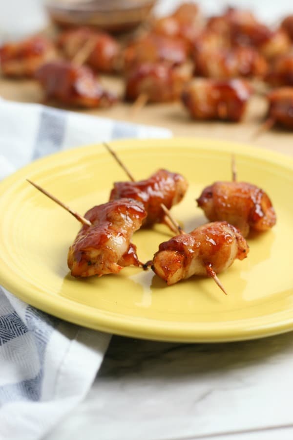 Pieces of bacon wrapped chicken on a plate