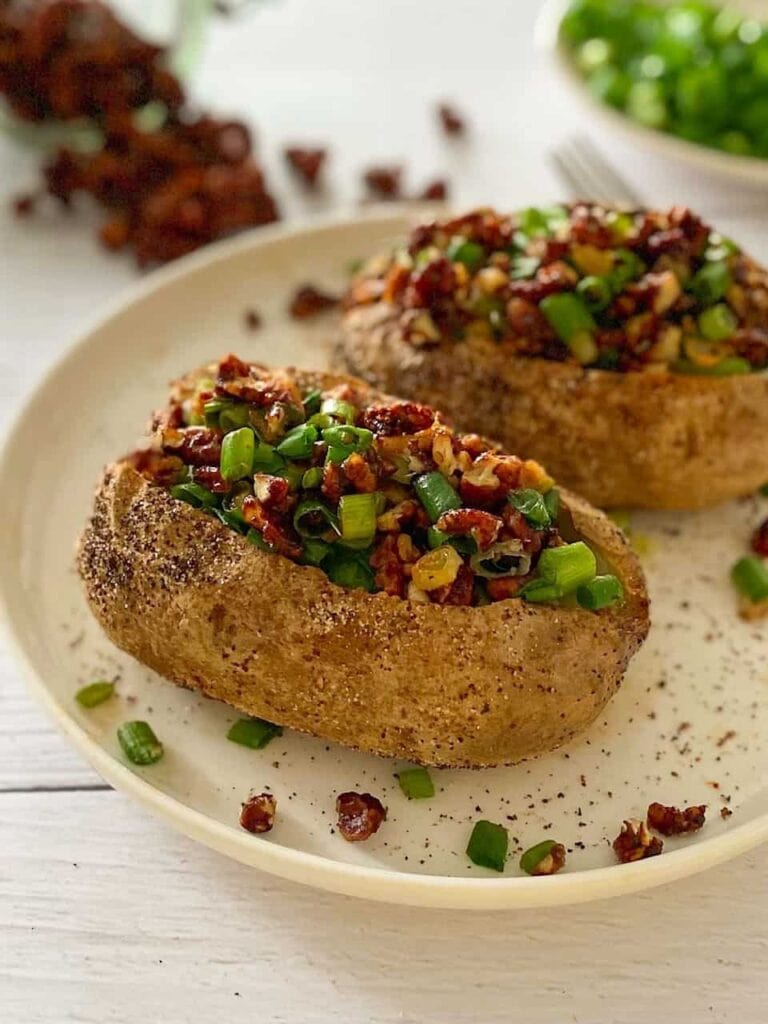 2 baked potatoes with garnish