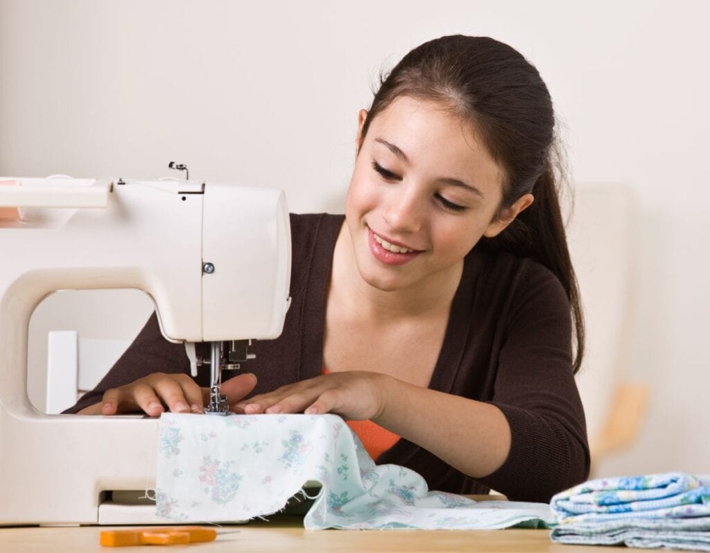 teenage girl sewing