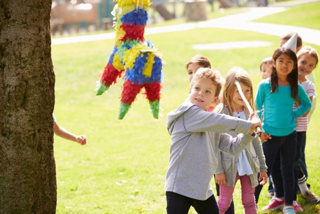 kids in line to hit a pinata