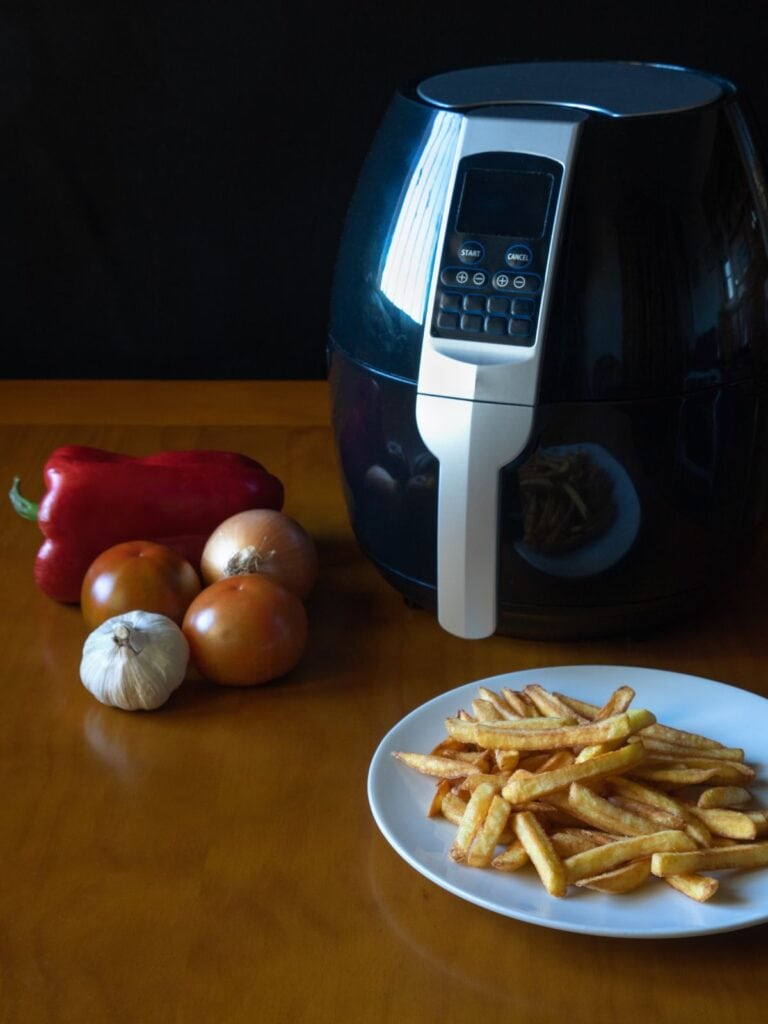 Air fryer, veggies, and fries on a plate
