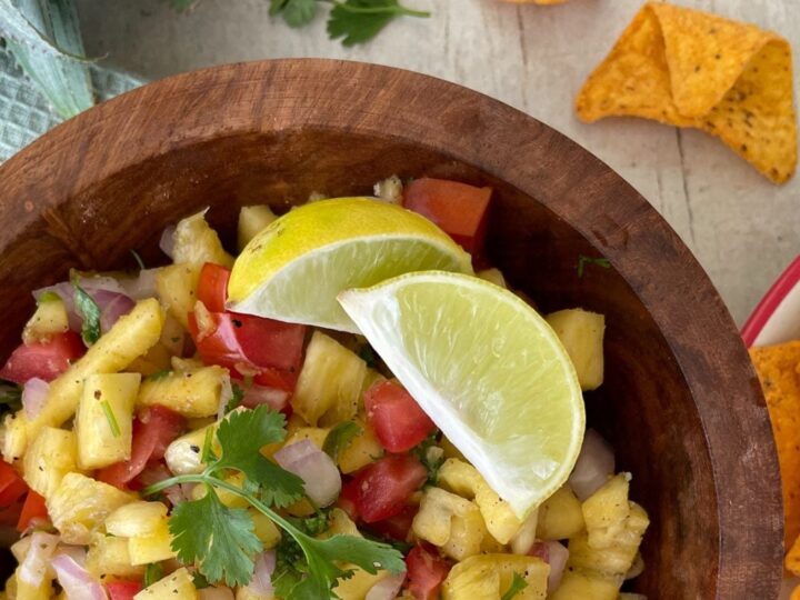 Salsa with lemon wedges and tortilla chips