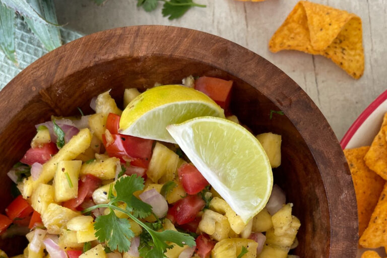 Salsa with lemon wedges and tortilla chips