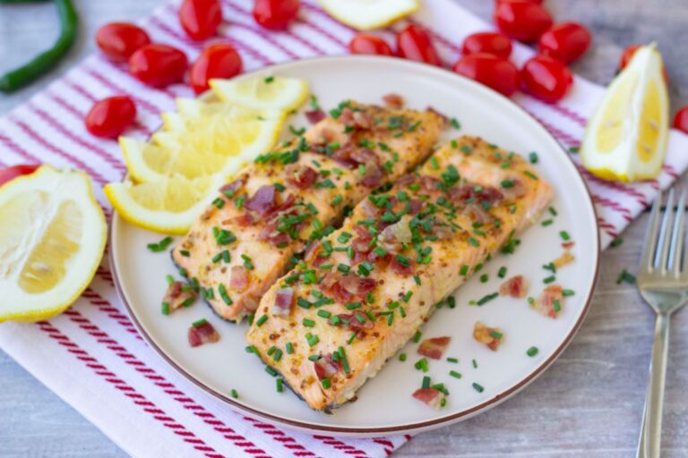plate of air fried salmon with lemon slices