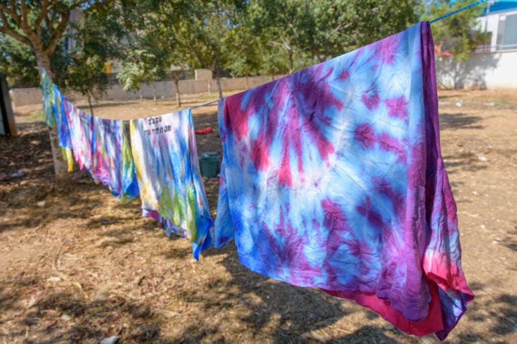tie dye shirts on a clothesline