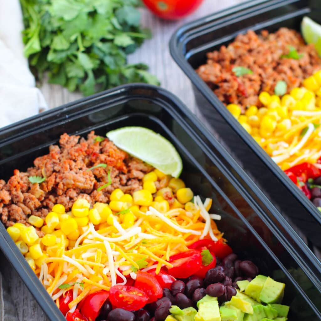 close up picture of burrito ingredients in a container