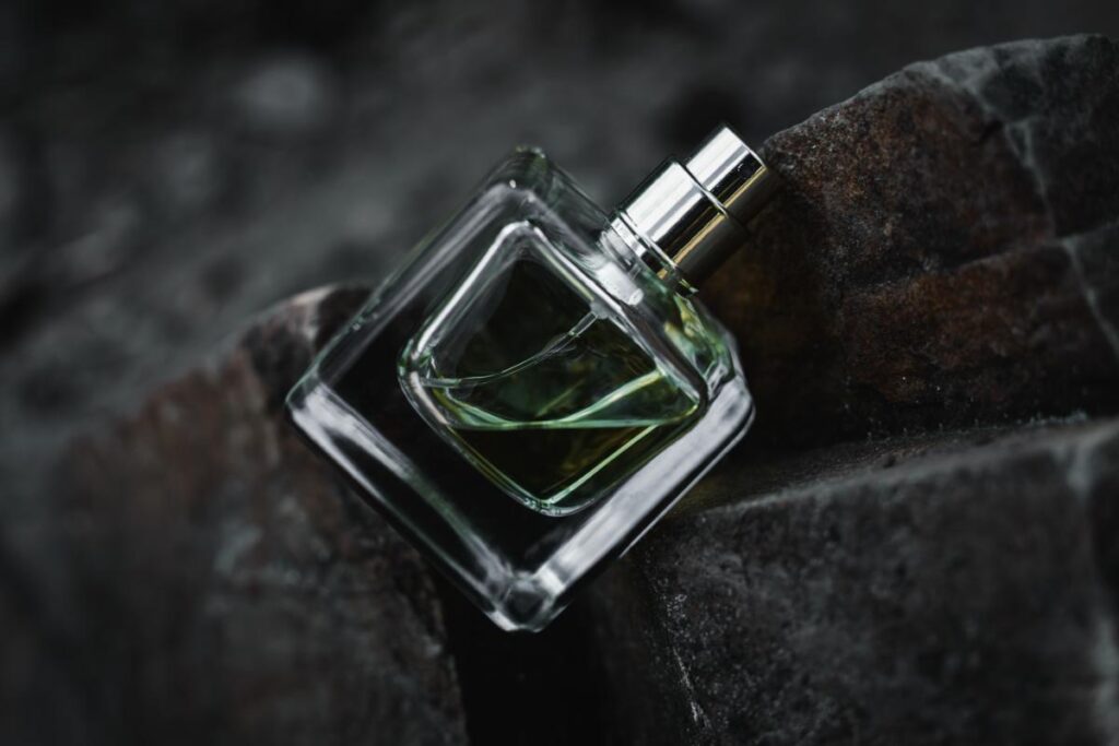 picture of a perfume on a rock