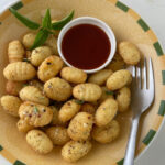 Air Fried Gnocchi with Dipping Sauce on a plate