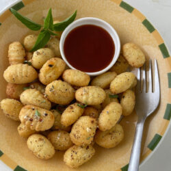 Air Fried Gnocchi with Dipping Sauce on a plate