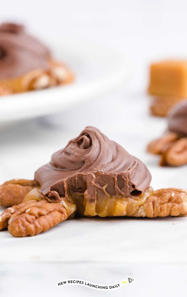 Pecan nuts topped with chocolate swirls