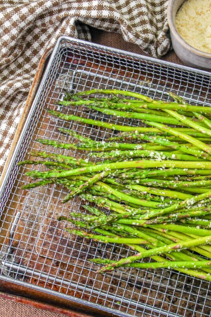 asparagus on a strainer with cheese