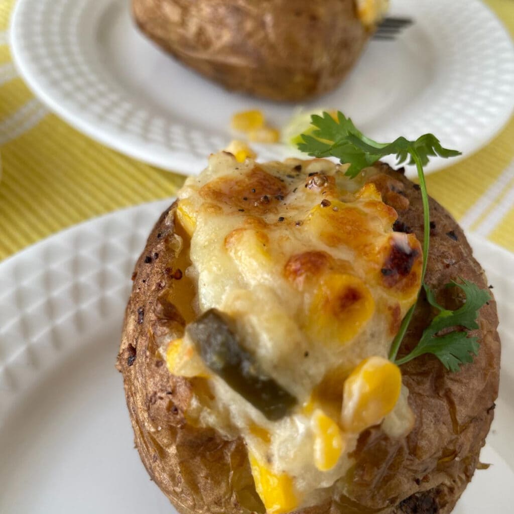close up view of baked potato with cilantro