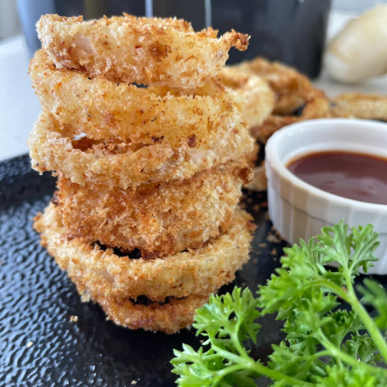 stacked onion rings on a serving platter