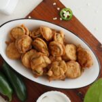 platter of jalapeno coated in batter