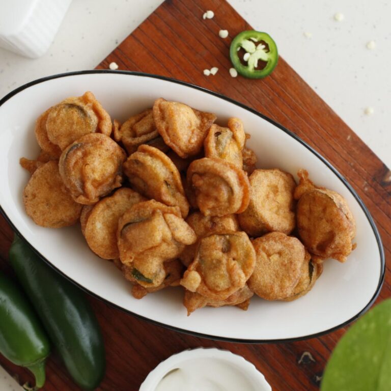 platter of jalapeno coated in batter