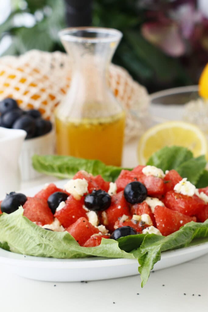 plate of fruit and veggie salad with cheese on top