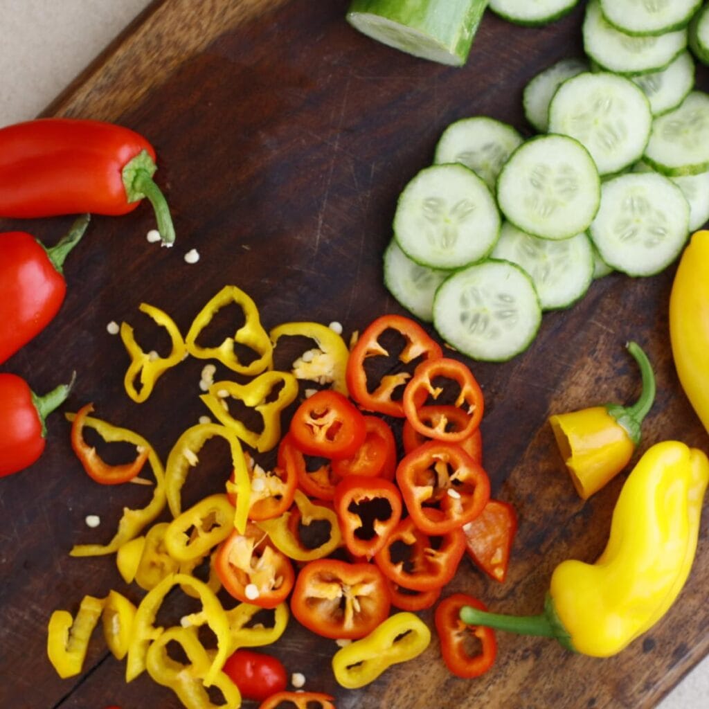 sliced mixed colored peppers and cucumbers
