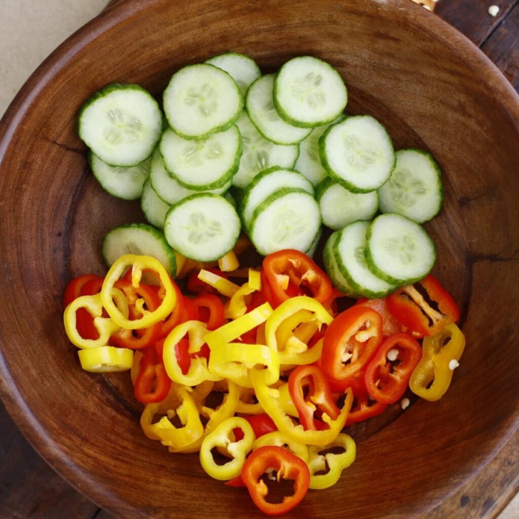 cucumber and bell pepper in a salad bowl