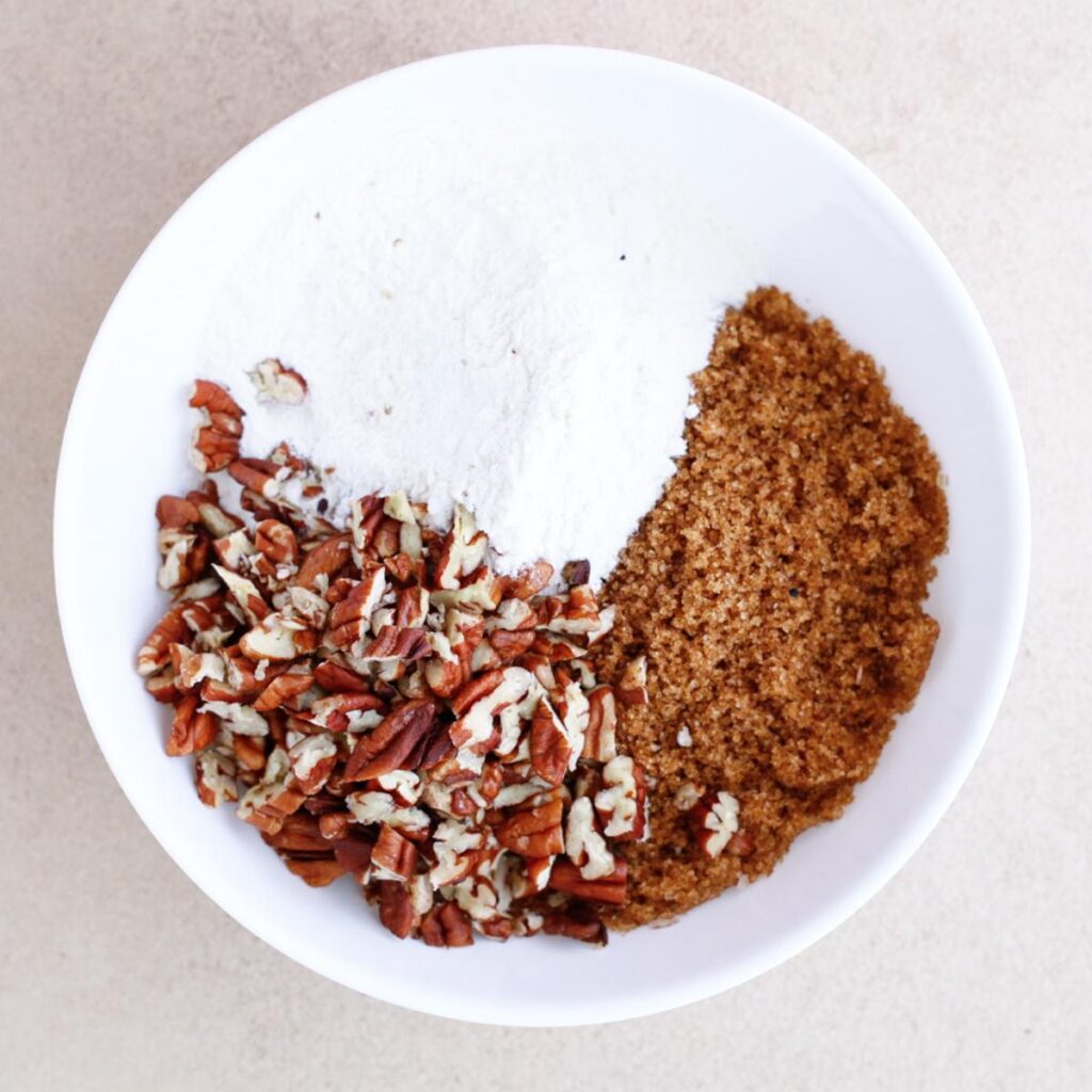 sugar, flour, and pecan bits on a plate