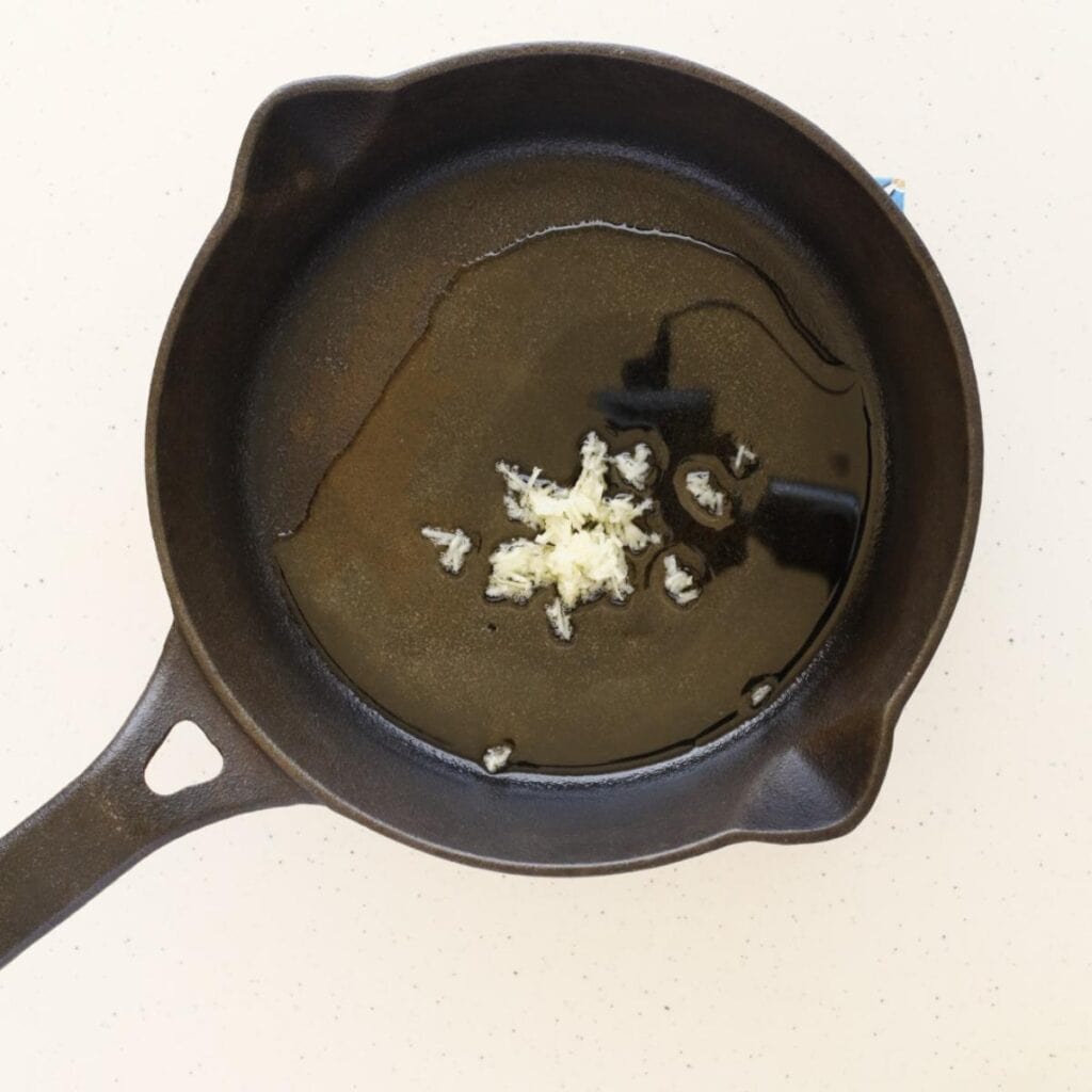 skillet with oil and garlic