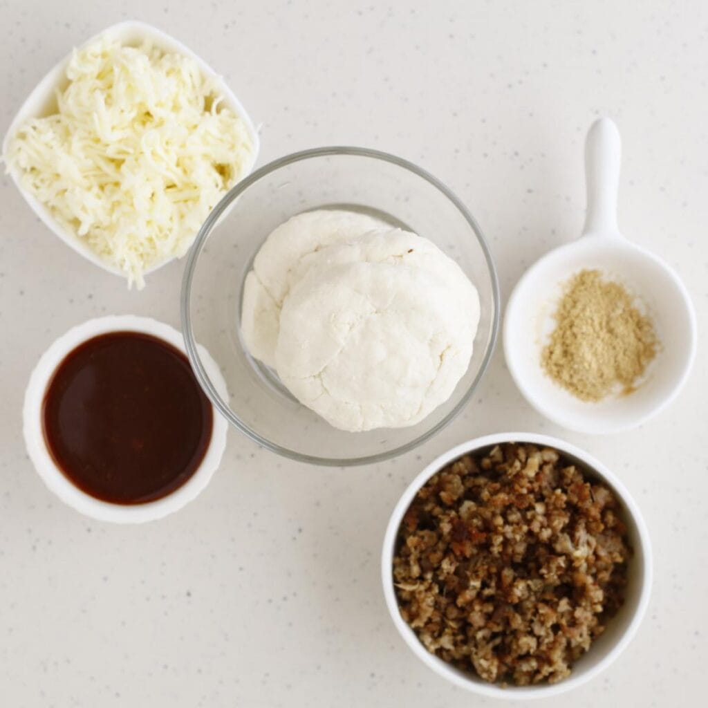 biscuit dough, onion powder, ground beef, bbq sauce, and cheese