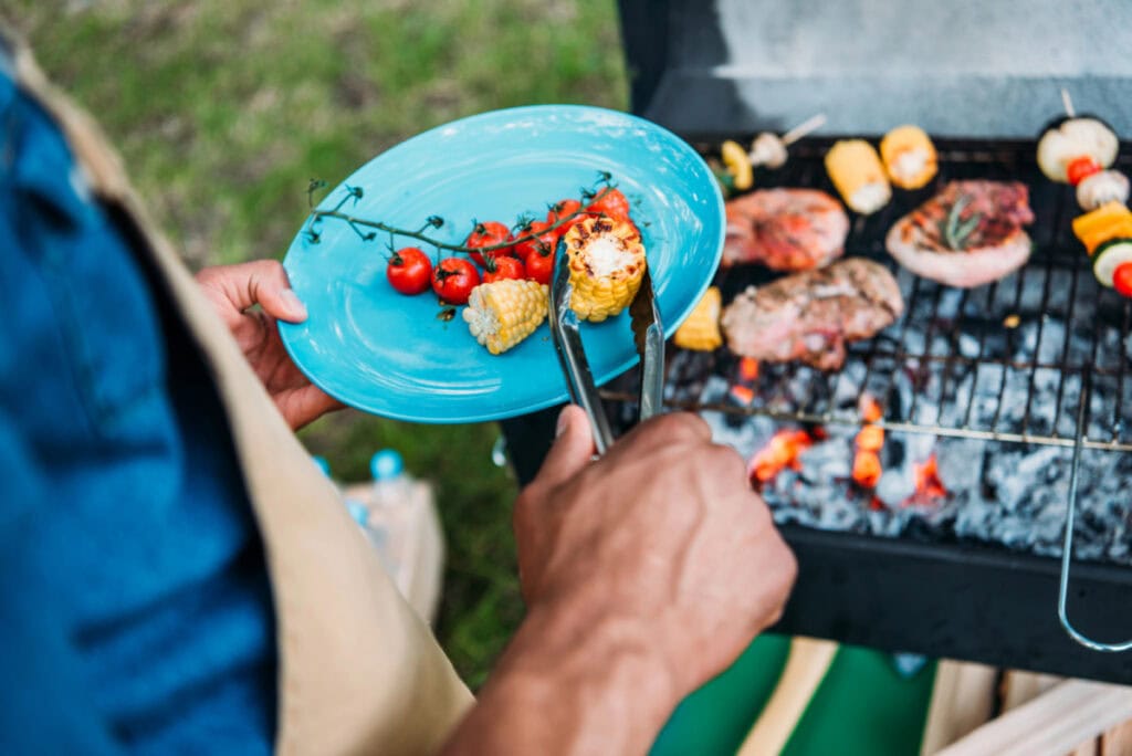 grill with various meats on it