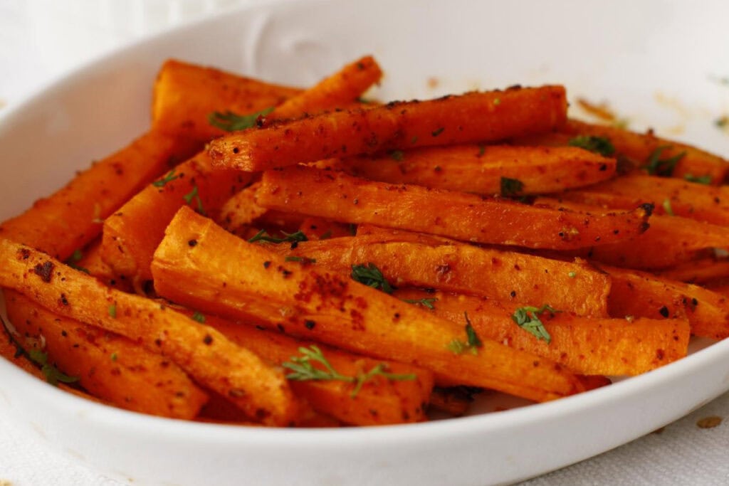 Close up view of carrot fries on a platter