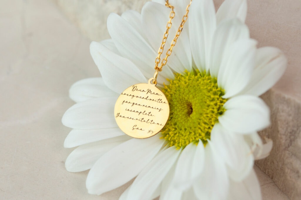 personalized pendant on a gold necklace