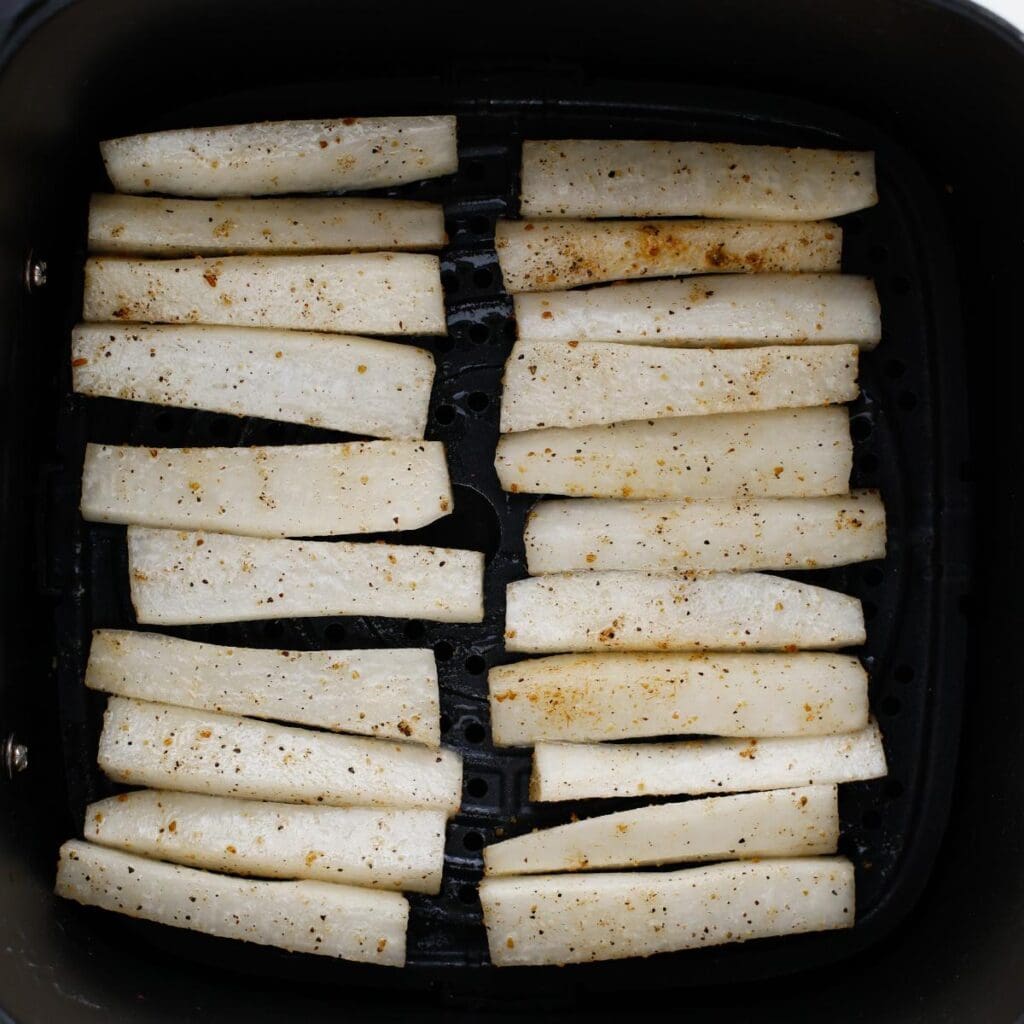 single layer of radish fries in an air fryer