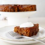 slice of jamaican cake with whipped cream