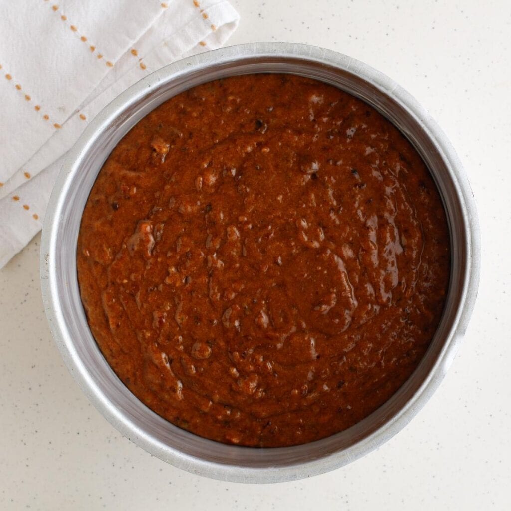 cake batter with fruits in a cake pan