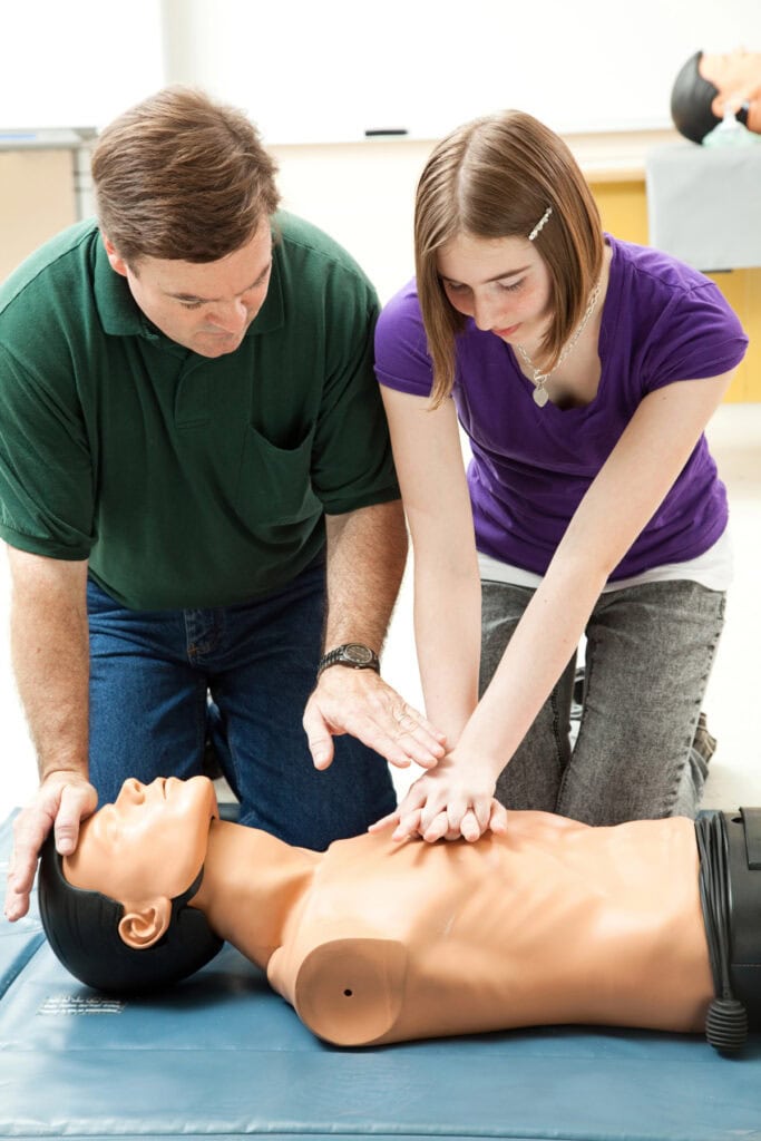 adult and teen learning CPR