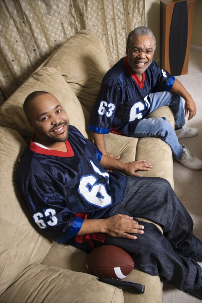 son and father wearing custom football jerseys