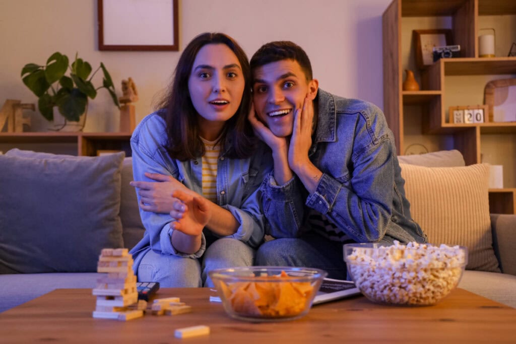 two people watching a movie