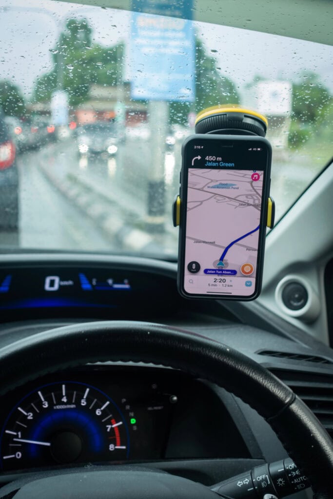 car with a phone with GPS map on the screen