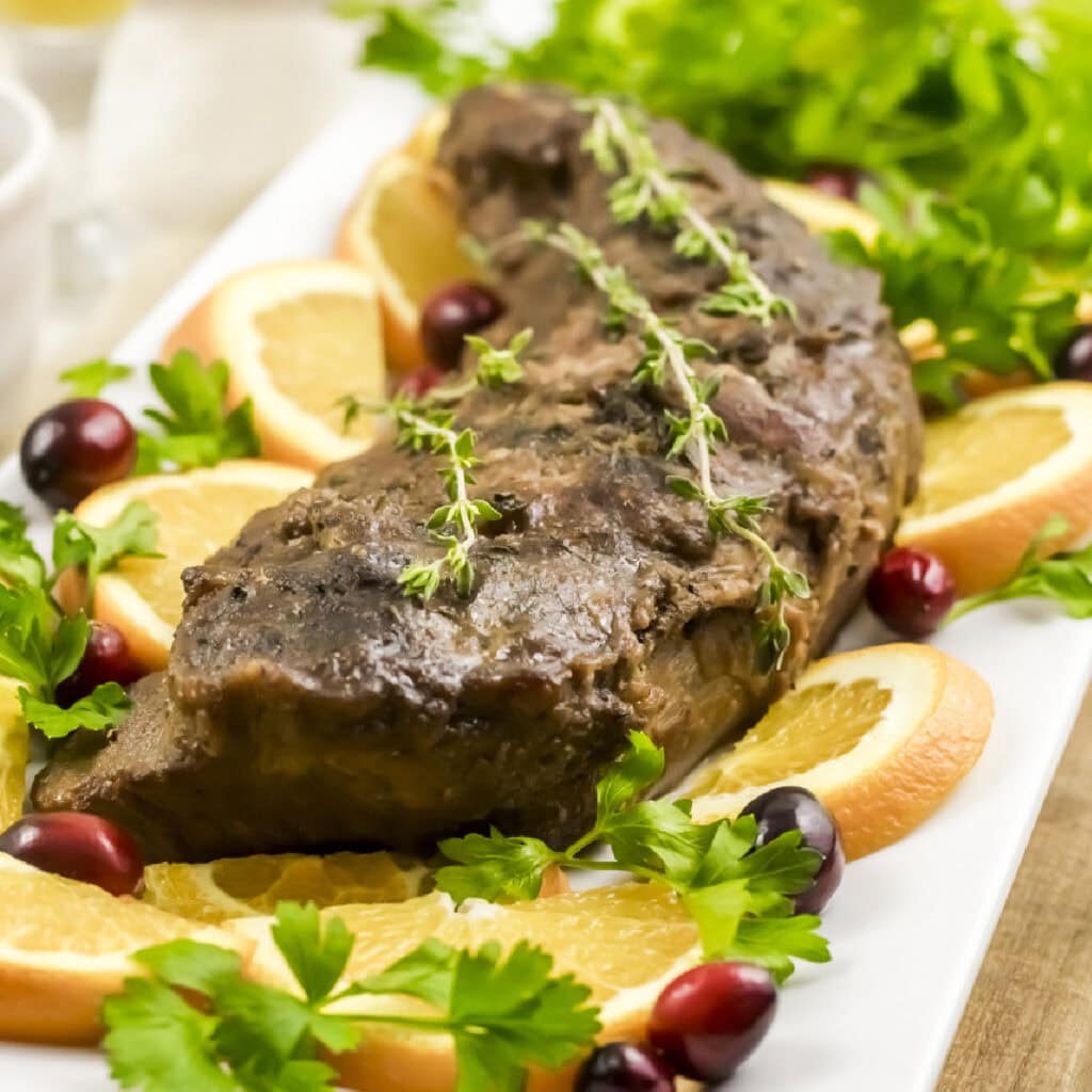 Uncut pork tenderloin single plate serving.