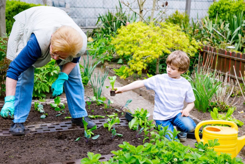 woman and son working in garden