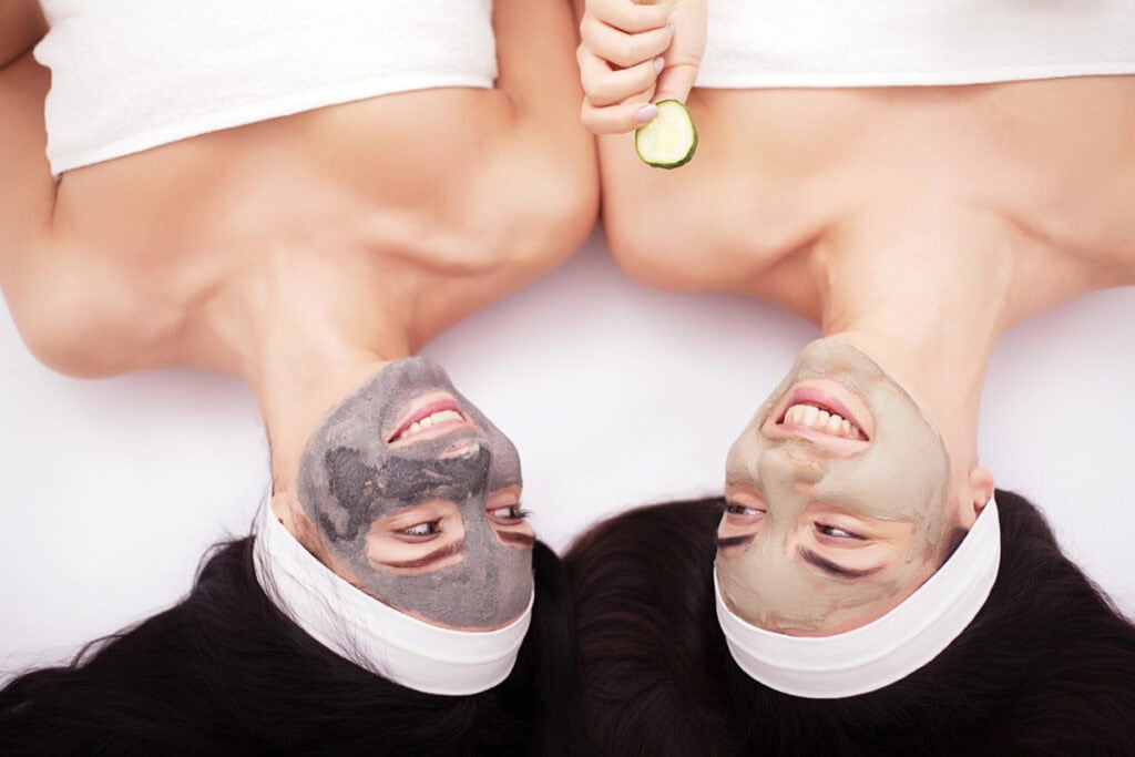 two women in mud masks
