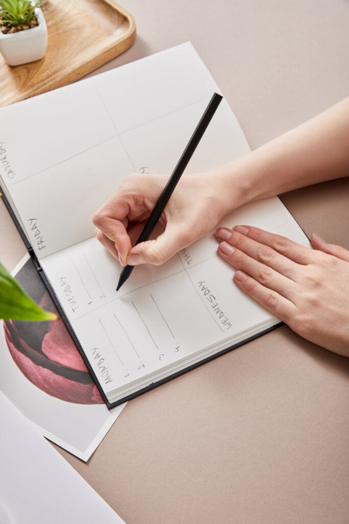 woman writing in a journal